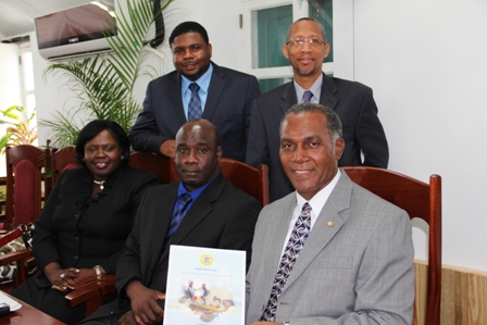 Premier of Nevis and Minister of Finance Hon. Vance Amory (front row extreme right) holds a hard copy of the Nevis Island Administration’s 2013 Budget Address, moments after he delivered it at the Nevis Island Assembly on April 26, 2013 with (L-R front row) Hon. Hazel Brandy-Williams, Hon. Alexis Jeffers (back row) Hon. Troy Liburd and Legal Advisor Mr. Colin Tyrell